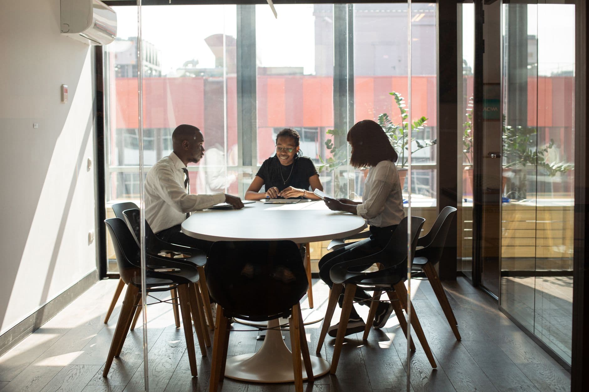 Modern Dubai office with professionals consulting business group documents