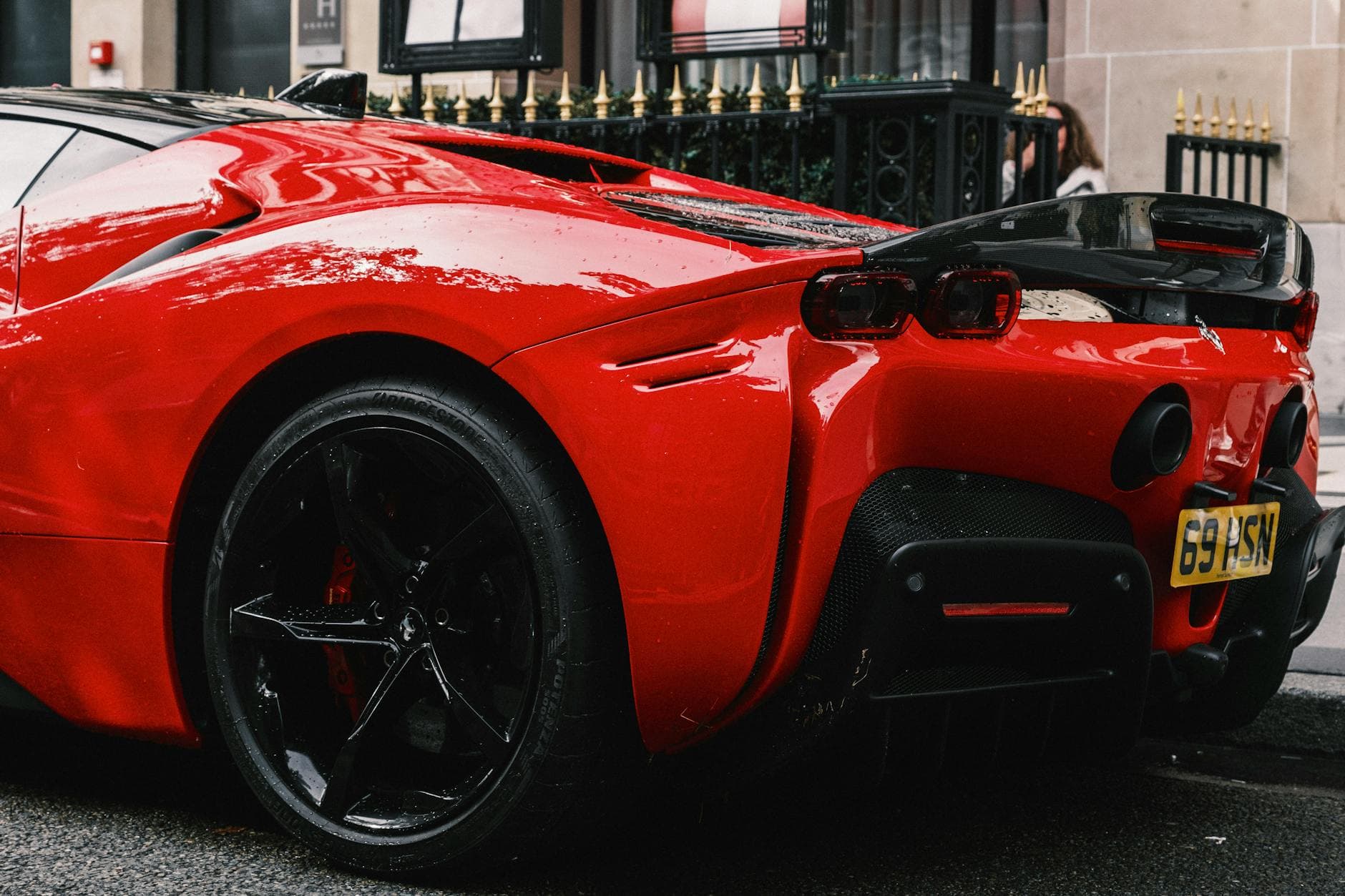 Red 2026 Ferrari SF90 Stradale parked in front of Burj Khalifa Dubai 1000 hp hybrid hypercar