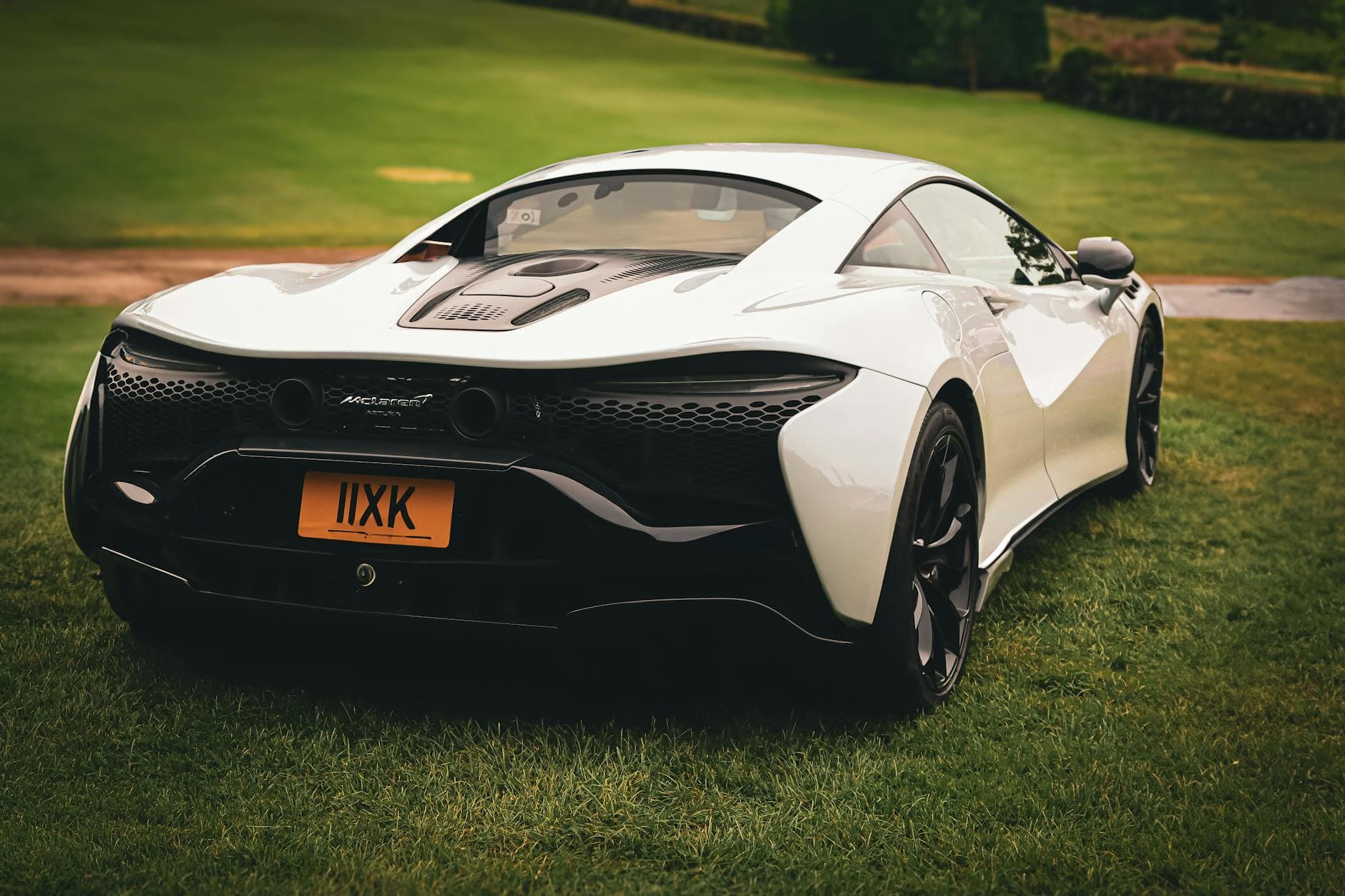 Orange McLaren 720S parked front Burj Khalifa Dubai special day rental